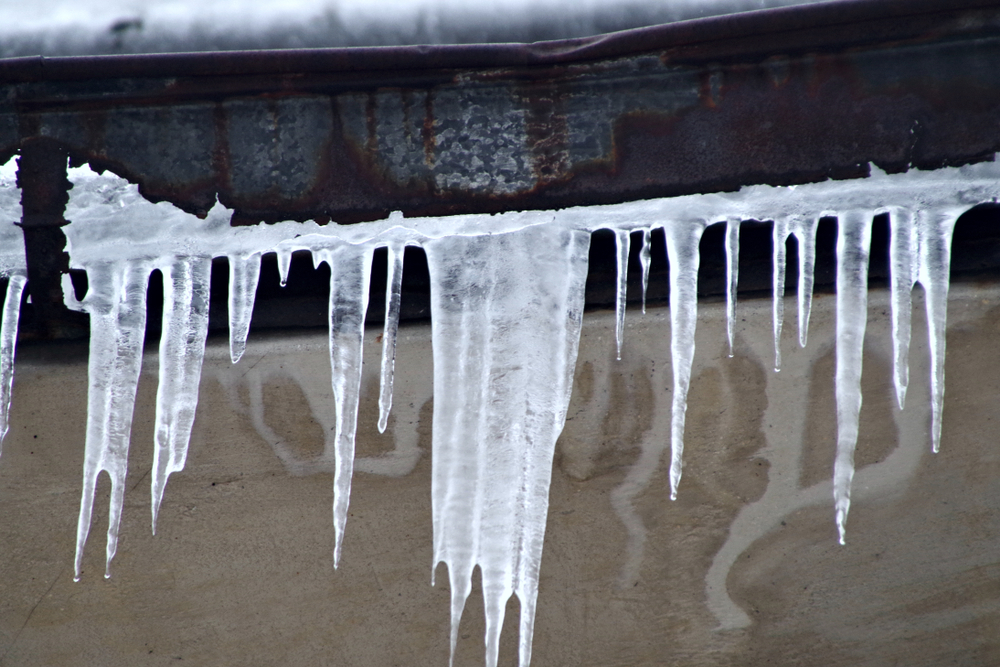 winter icicles hanging from pipe